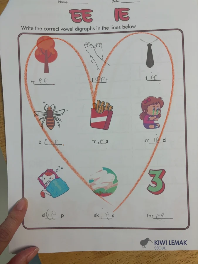 Completed phonics vowel-digraph homework worksheet