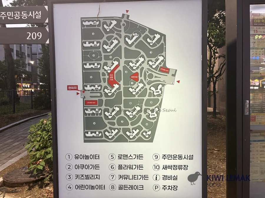 Apartment complex facility map board showing numbered buildings and amenity legend