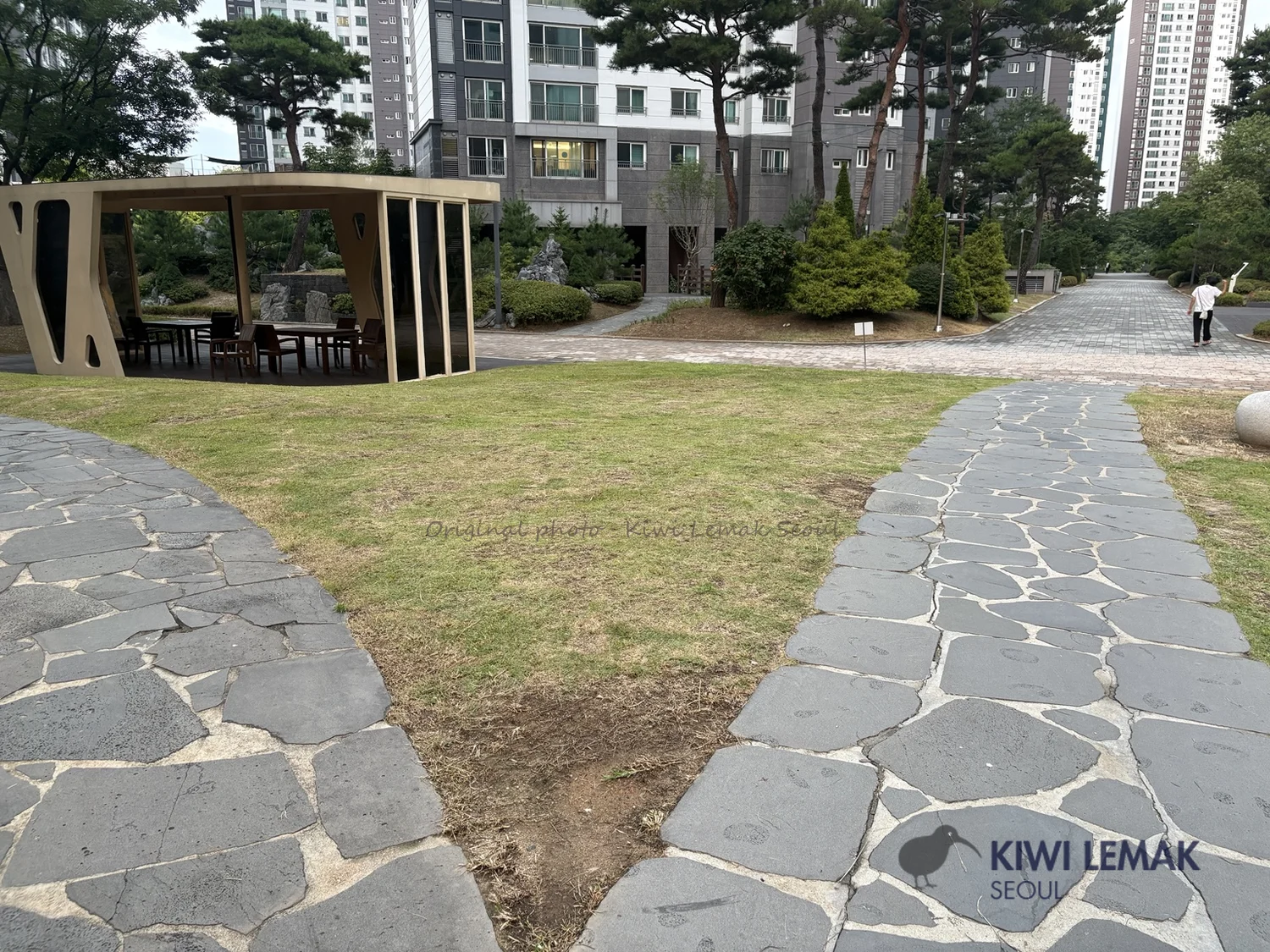 Landscaped courtyard and gazebo seating area inside a Korean apartment complex