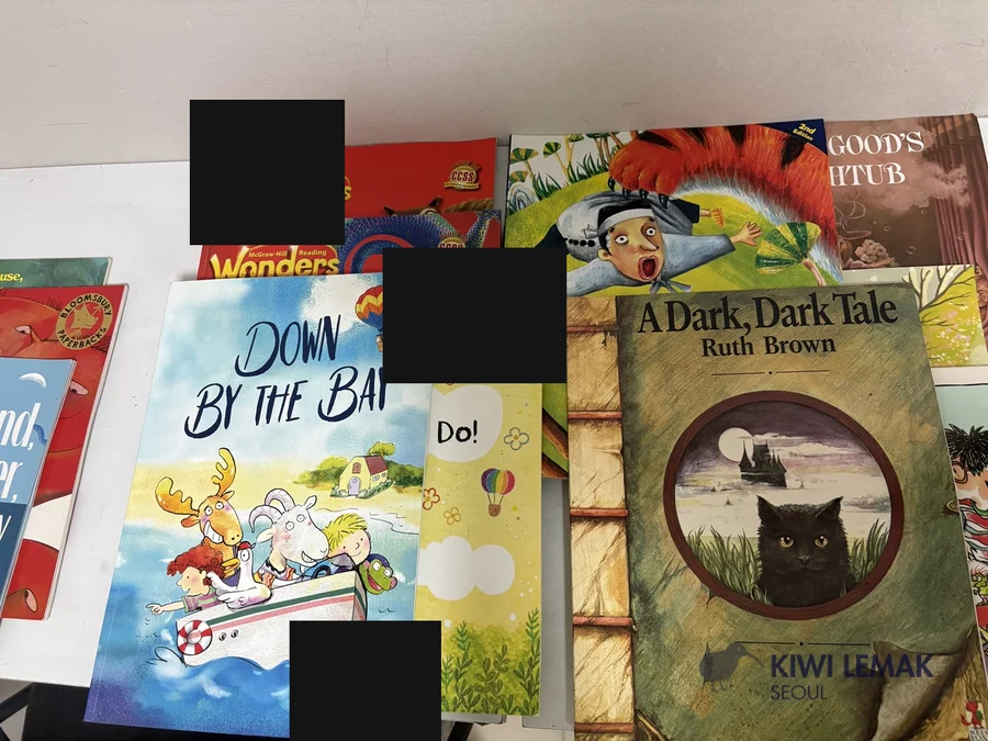 Stack of real English leveled-reader books used in an English kindergarten program in Korea
