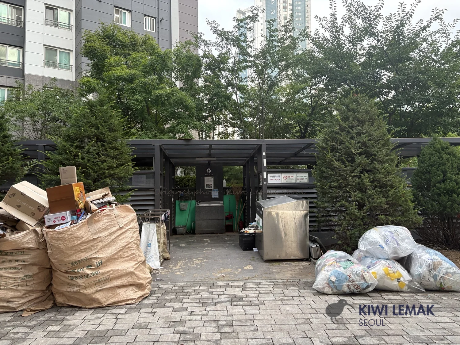 Wide view of a recycling collection area entrance in a Korean apartment complex